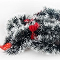 Christmas tinsel garland in dark green and white mix with festive red velvet bows - Dark Green White Edge With Red Bows