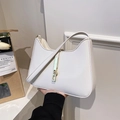 White faux leather hobo bag for women featuring a stylish gold metal buckle lock - Off White