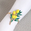 Golden lemon napkin ring with yellow enamel fruit and green leaves for table decor - Style 6 (Four Lemons)