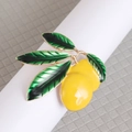 Vibrant lemon napkin ring with green leaves and yellow enamel on a metal holder - Style 7 (Lemon with Leaves)