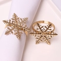 Golden snowflake napkin rings with polished hollow metal design for holiday table decor - Gold Snowflake