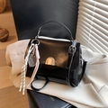 Glossy black faux leather handbag with gold arc buckle and decorative tennis racket charm - No Pendant / Black