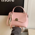 Fashionable soft pink faux leather handbag with metal buckle and woven strap detail - No Pendant / Pink