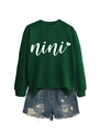 Detail view of the embroidered nini heart logo on dark green round neck sweatshirt - S / Dark Green (White Font)
