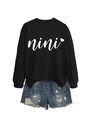 Detailed shot of a black crewneck sweatshirt with nini heart print and ripped denim shorts - S / Black (White Font)