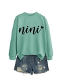 Detail of mint green sweatshirt with nini heart print and distressed denim shorts - S / Light Green (Black Text)