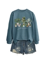 Flat lay of blue crew neck sweatshirt with botanical houseplant print and denim shorts - Blue Sweatshirt (White Text)