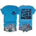Flat lay of bright blue Sports Mama t-shirt with distressed denim shorts - Lake Blue (Black Font)