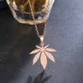 Bohemian rose gold maple leaf necklace pendant in stainless steel on a dark textured background - Rose Gold (N217-R)