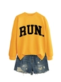 Flat lay of yellow long-sleeve sweatshirt with black RUN lettering and denim shorts - Yellow (Black Font)