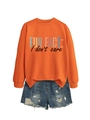 Détail d'un sweat orange avec imprimé Fun Fact et short en jean bleu délavé - S / Noir Imprimé / Orange