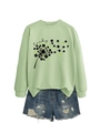 Detail of clover dandelion print and lucky typography on green sweatshirt with denim shorts - Olive Green (Black Letters)