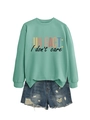 Détail du sweat vert menthe avec imprimé fun fact et short en jean vieilli - S / Noir Imprimé / Vert clair