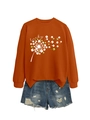Flat lay of an orange lucky clover sweatshirt paired with distressed denim shorts detail - Rust Orange (White Graphic)