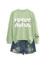 Detail of sage green sweatshirt with NURSE future print and distressed denim shorts - Olive Green Sweatshirt (Black Text)