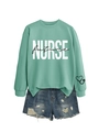 Detail of mint green Nurse Future sweatshirt with white bold text and blue denim shorts - Light Green Sweatshirt (Black Text)