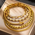 Close-up of gold layered chain bracelet set with Cuban and paperclip links - Gold Bracelet Set (N9121)