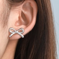 Elegant polished silver bow-knot stud earrings in 18K gold plated stainless steel - Silver Bow (C1320)