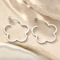 Elegant silver-toned hollow five-petal flower stud earrings on a marble base - Silver Hollow Flower Style (B4074)