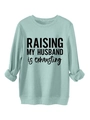 Close-up of mint green crewneck sweatshirt with Raising My Husband lettering - S / Light Green
