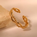 Gold stainless steel twisted open ring with beaded texture on a marble background - Gold Beaded Chain Style (C3341)