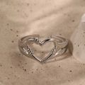 Minimalist silver open ring with hollow heart design and rope texture on sand background - Silver Heart Style (C3362)