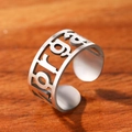 Adjustable silver stainless steel ring featuring ethnic hollowed-out script on wooden background - Silver Hollow Style (T18-X04)