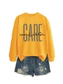 Detail of yellow round neck sweatshirt with grey CARE coordinator print and denim shorts - Yellow (Black Print)