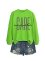 Detail of neon green crewneck sweatshirt with CARE print and distressed denim shorts - Fluorescent Green (Black Print)