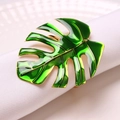Green and gold monstera leaf napkin ring on white napkin for wedding table decor - Simulated Monstera Leaf (ZWZ-INR-447)