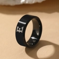 Polished black stainless steel signet ring featuring a silver gothic letter E engraving - Letter E