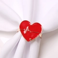 Elegant gold napkin ring with red enamel heart featuring heartbeat pattern decoration - Red Letter Heart Style