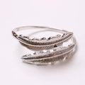 Silver double feather napkin ring with intricate carved texture on metal surface - Silver