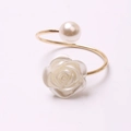 Elegant gold metal ring featuring a white faux pearl and carved resin flower detail - Rose Style