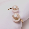 Elegant gold-tone open ring featuring dual pearls with small diamond accents - Pearl Style