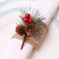 Close-up of Christmas napkin ring with pine cones, red berries and burlap lace band - Red Berry Double Pine Cone Burlap Lace Style
