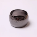Macro detail of gunmetal napkin ring with vintage embossed floral rose pattern textures - Floral Embossed Gun Black / Gun Black