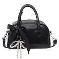 Chic black bowling handbag featuring elegant pearl bow charms and satin ribbon details - Black