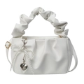 White PU leather cloud pleated handbag with pearl bow and heart charm on white background - White