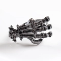 Black metal gothic skeleton hand napkin ring with skull carving for Halloween table decor - Skeleton Hand