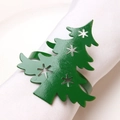 Detailed close-up of green Christmas tree napkin ring with snowflake hollow patterns - Christmas Tree