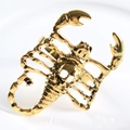 Golden skeleton scorpion napkin ring in punk style with detailed vintage metal finish - Lobster