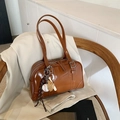 Brown faux leather bowling bag with baseball charm and sleek silver hardware - With Pendant / Brown
