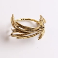 Macro detail of antique gold olive leaf napkin ring with vintage metallic texture - Retro Branch Leaf Shape (Style 5)