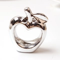 Silver apple-shaped napkin ring with hollow design and shiny mirror electroplated finish - Silver Apple Style