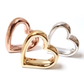 Three-piece heart napkin rings set in polished gold, rose gold, and silver metal finish - Heart