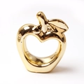Modern apple-shaped napkin ring with a sleek gold-plated finish for table decor - Gold Apple Style