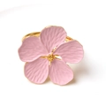 Close-up of pink flower napkin ring with gold stamens and detailed textured petals - Pink