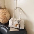 White minimalist faux leather tote bag with stylish baseball charms and silver hardware - White