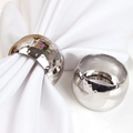 Close-up of silver hammered texture napkin rings on a white cloth for table decor - High Quality Silver / Silver